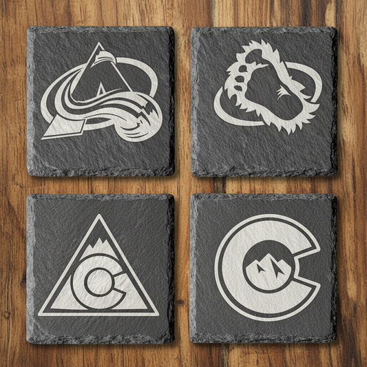 Slate coasters on wood background